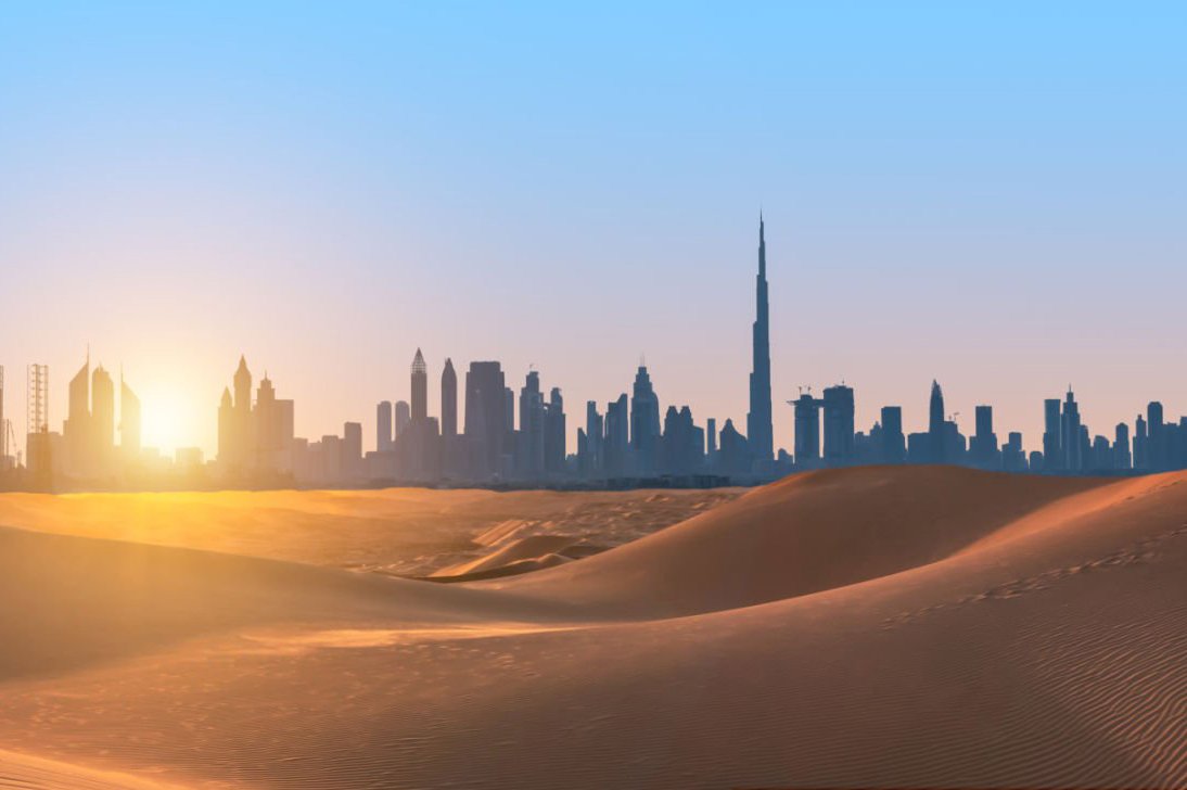 Dubai city skyline sand dunes